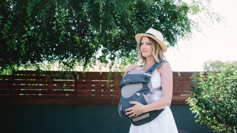 woman holding baby in ergobaby 360 carrier