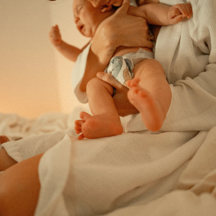 Person holding a crying baby