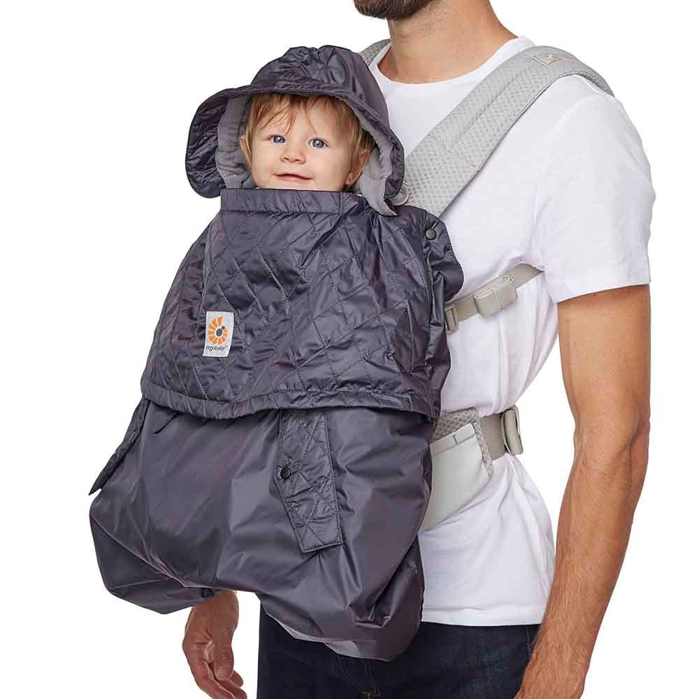 Dad wearing baby outward facing with All Weather Carrier Cover | Ergobaby United States