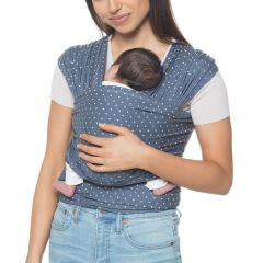 Mom wearing baby inward facing in Aura Wrap Coral Dots Baby Carrier