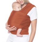Mom wearing baby inward facing in Aura Wrap Copper Baby Carrier