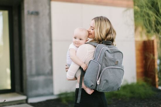 woman kissing baby's head