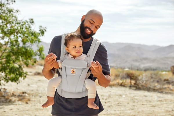 Man with baby carrier online