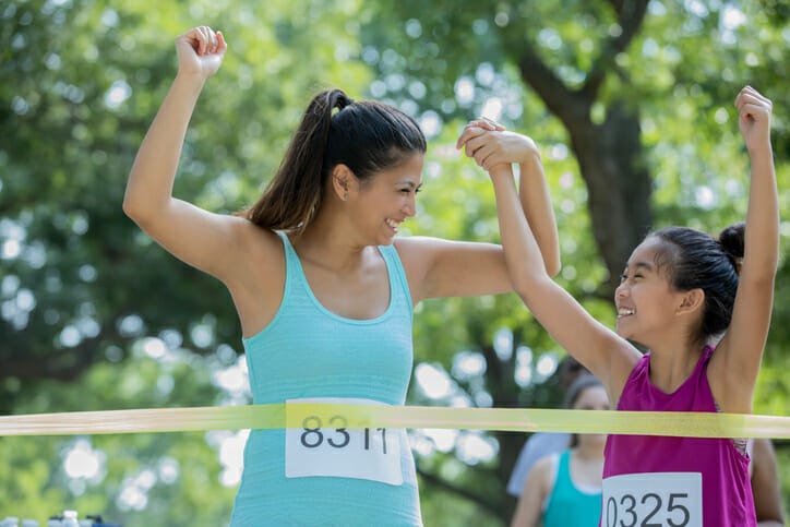 mother and daughter finish a race