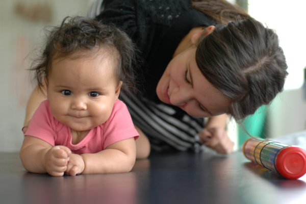 mom playing with baby