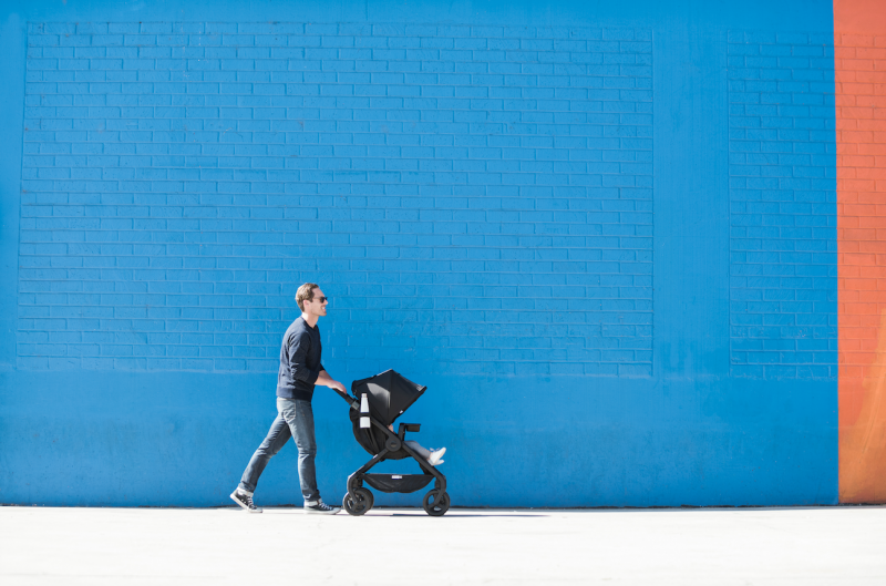 dad pushing baby in stroller