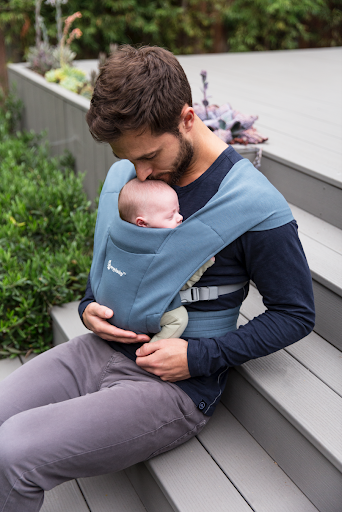 Dad on bench with Ergobaby