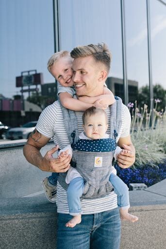 Dad with two kids using Ergobaby