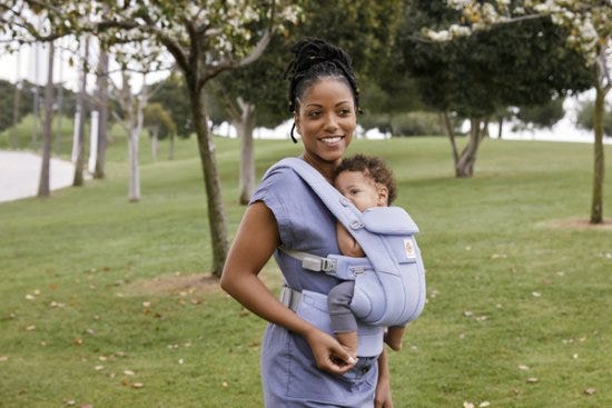 Mom outdoors baby wearing her son