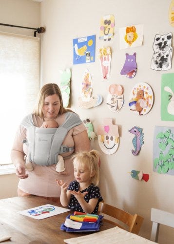 mom in baby carrier 